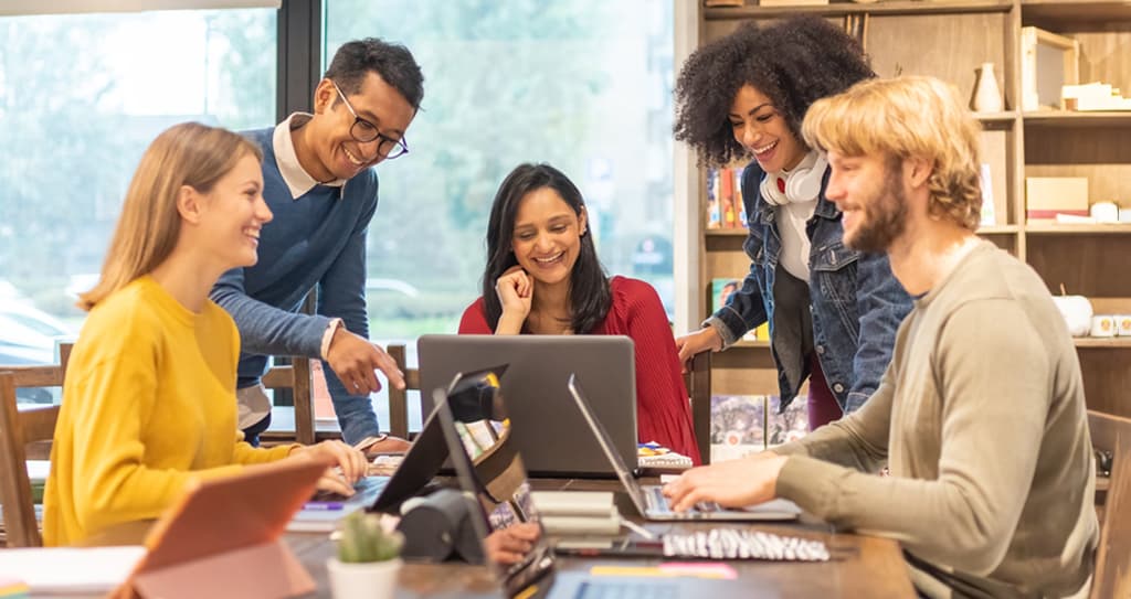 Rapid Eagle team collaborating in a casual office setting
